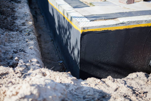 Professional Basement Waterproofing technician working in Union Mills, IN